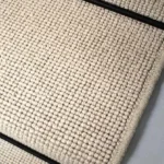 Close-up-of-a-Charter-Plain-Loop-Knight-Stair-Runner-with-a-black-border