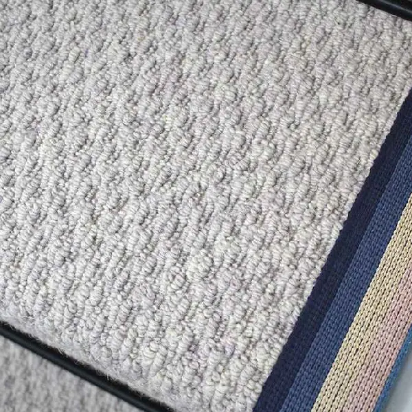 Close-up-of-a-French-Grey-Small-Boucle-Wool-Stair-Runner-with-a-stripe-border