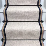 French-Grey-Small-Boucle-Wool-Stair-Runner-with-black-stair-rods-and-a-stripe-border