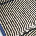Hardy-striped-wool-stair-runner-with-blue-edging-and-black-stair-rod