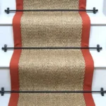 Herringbone-Pewter-Sisal-Stair-Runner-on-a-staircase-with-a-black-border