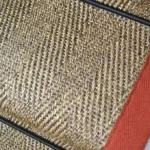 Herringbone-Pewter-Sisal-Stair-Runner-on-a-staircase-with-a-black-border.-1